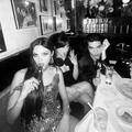 (Left to Right) Olivia Rodrigo, Jenna Ortega, and Conan Gray sitting in a booth at a restaurant.